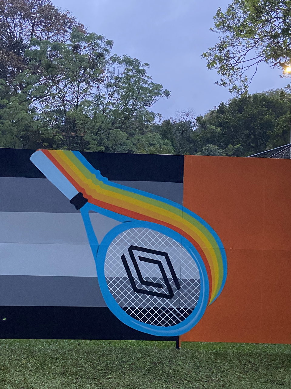 Finished panel with a giant rainbow tennis racket
