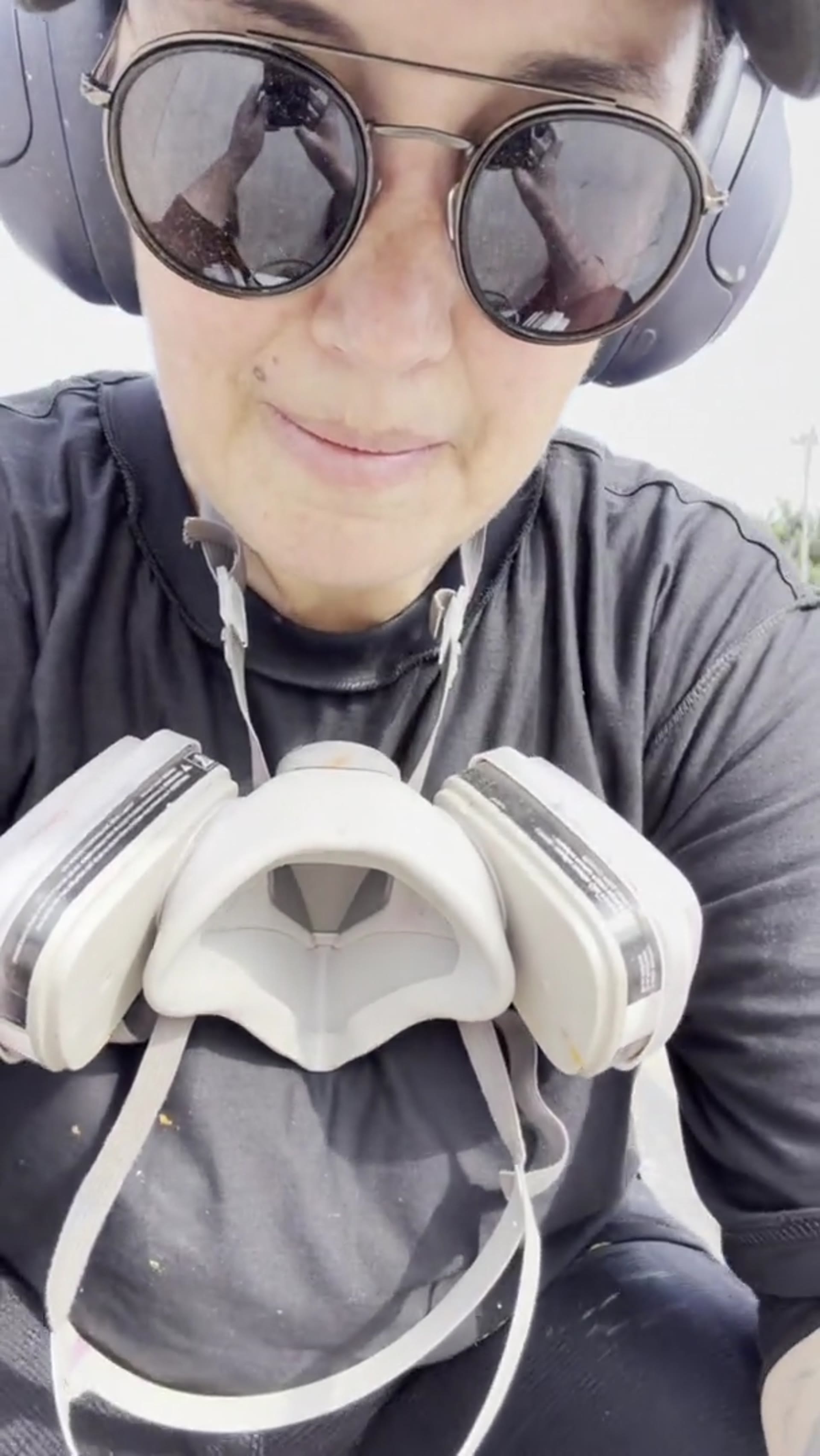 Behind the scenes at the wall: selfie, spray can and scattered tins