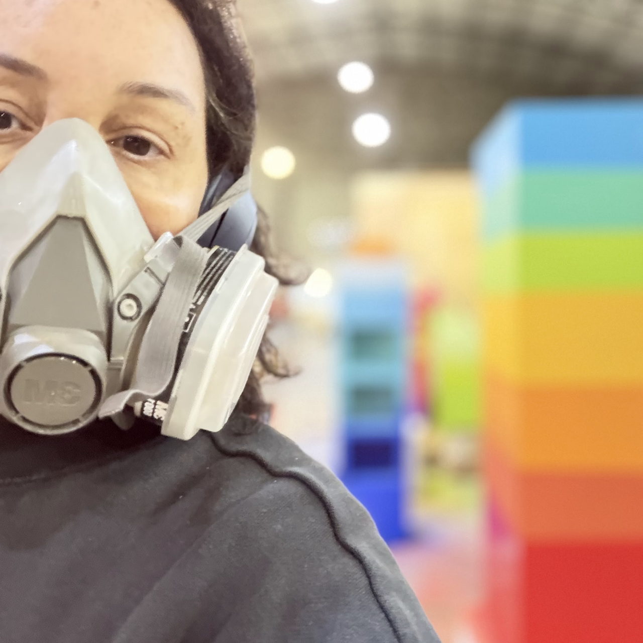 Artist's selfie in a respirator in the workshop