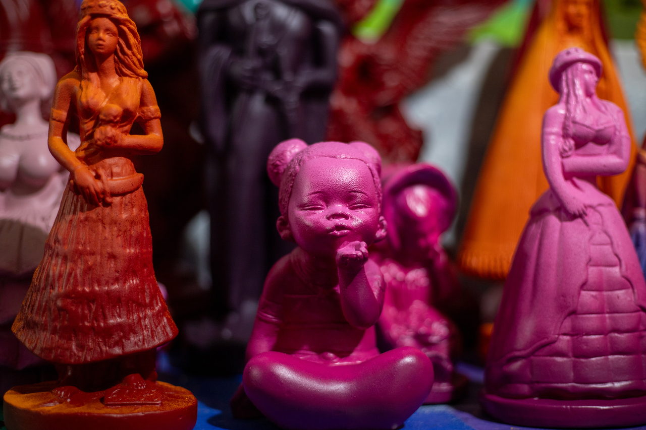 Pink, magenta and orange figures from the saints installation
