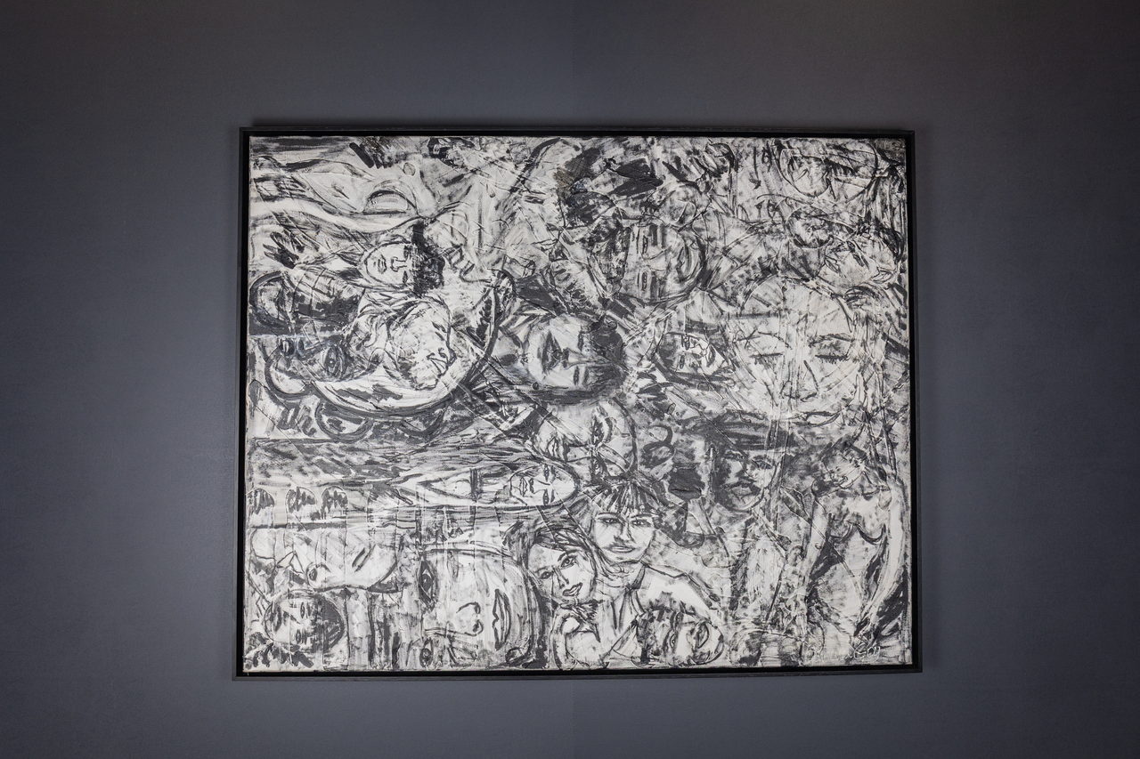Toile en noir et blanc avec des visages entrelacés
